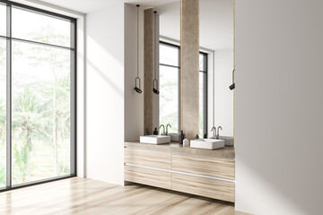 Corner view on bright bathroom interior with mirrors, panoramic window