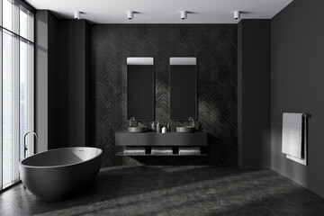 Black bathroom interior with sink and bathtub, accessories and panoramic window