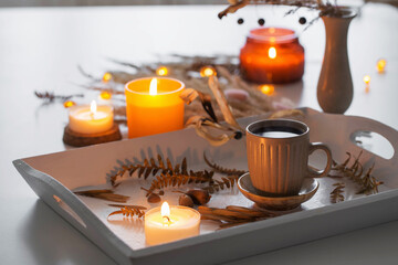 two cups of  coffee    and autumn decor on white wooden tray