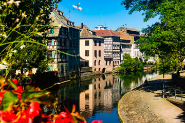 Fototapeta na wymiar Summer view of the streets and canals of the city of Strasbourg, located on the eastern side of France