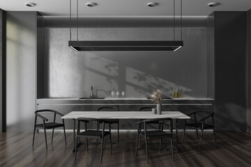 Grey kitchen interior with chairs and dining table, kitchenware