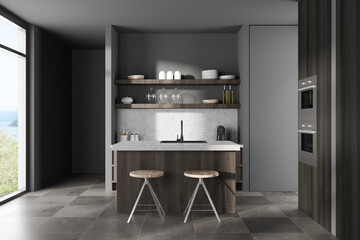 Grey kitchen interior with bar island and stool, shelves and panoramic window