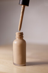 glass container with make-up base and dropper applicator