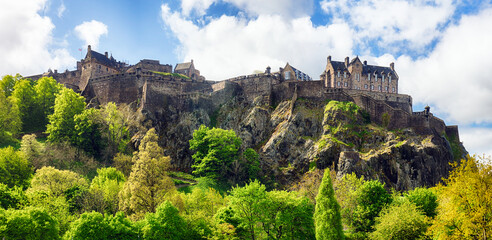 Fototapeta na wymiar Castle hill in Edinburgh with green grass and blue sky, Scotland, UK