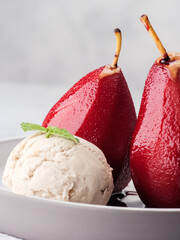 Composition with sweet poached pears and ice cream on light background