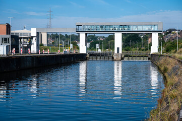 Namur, Wallon Region, Belgium, The city sluice reflecting in the water of the River Sambre