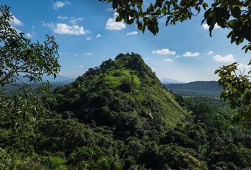 Fototapeta na wymiar View of the green hill from the temple complex in Dambulla, Sri Lanka