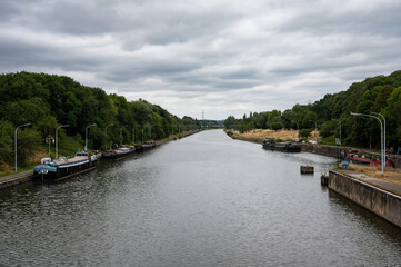Fototapeta premium Ronquieres, Wallon Region, Belgium , Canal with boats and industrial activity