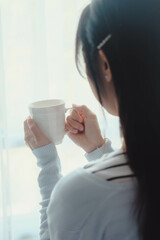 woman drinking coffee in morning