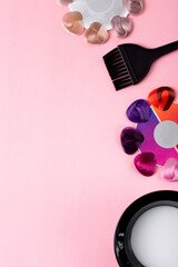 Professional hairdresser flat lay. Hair dye swatches of different colors, applicator brush and dye...