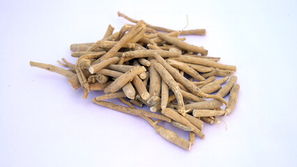 Ashwagandha Dry Root Medicinal Herb with Fresh Leaves, also known as Withania Somnifera, Ashwagandha, Indian Ginseng, Poison Gooseberry, or Winter Cherry. 