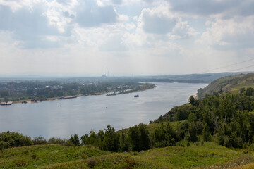 Wide river landscape: ship and barges on the Yenisei River