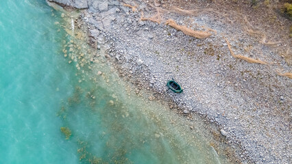 Rubber boat on the seashore. Lake shore
