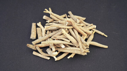 Ashwagandha Dry Root Medicinal Herb with Fresh Leaves, also known as Withania Somnifera, Ashwagandha, Indian Ginseng, Poison Gooseberry, or Winter Cherry. 