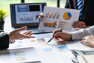 closeup shot of business people discussing performance revenue in the meeting. businessman working with a co-worker team. financial adviser analyzing data with the investor...