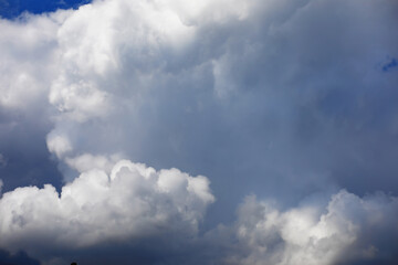 High clouds in the summer sky. Sky background. Meteorological observations of the sky.