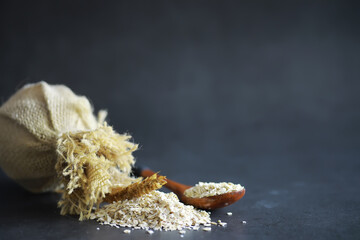 World grain crisis. A handful of cereals and on a dark background.