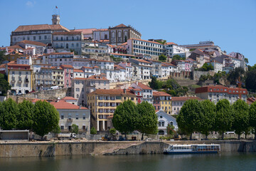 Fototapeta na wymiar Old part of Coimbra city at Mondego river in Portugal