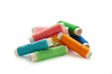 Color sewing threads isolated on white background.