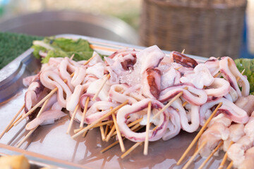 Fresh squid skewers for grilling
