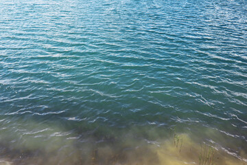 Water surface. The texture of the water. Waves on the lake in windy weather.