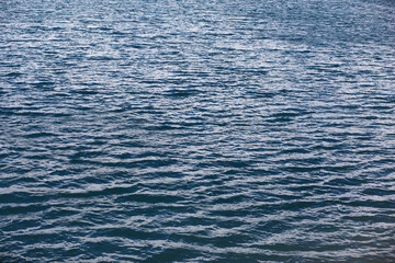 Water surface. The texture of the water. Waves on the lake in windy weather.