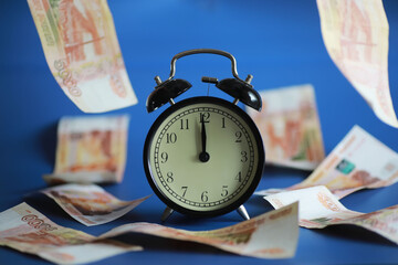 Retro keys on ropes in hand. Flying banknotes. Concept of business ideas.