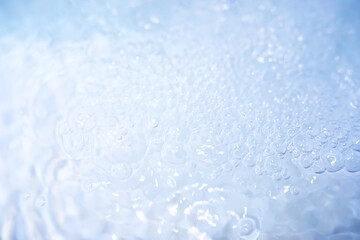 Blue water texture. Bubbles and bubbling water.