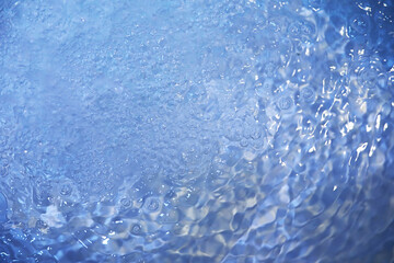 Blue water texture. Bubbles and bubbling water.