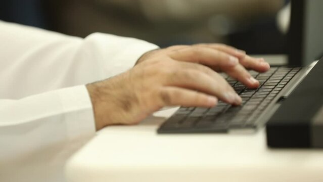 person typing on a laptop computer