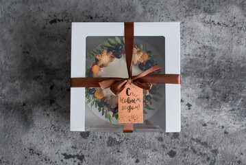 A box of pastries, a tag with the inscription 