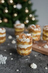 Pastries with caramel in transparent cups on the table