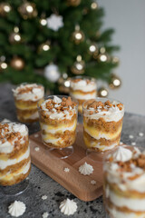 Pastries with caramel in transparent cups on the table