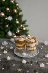 Pastries with caramel in transparent cups on the table