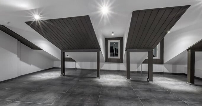 movement in circle of large empty mansard room as warehouse, hangar or gallary at night