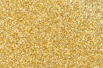 Luxury glitter in contrast gold color as part of your expensive design. Holiday abstract glitter background, pattern with blinking lights. Fabric sequins in bright colors. Fashion glitter, sequins.