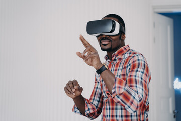 African american man in virtual reality glasses testing purchase, shopping in cyberspace. E commerce