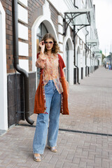 Beautiful woman walking down in the street