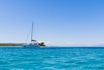 Catamaran sailing in ocean. paradise at sea. Blue sky and turquoise blue sea water. Mexican Caribbean beaches.