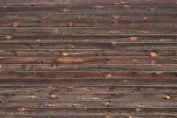 Wooden dark brown fence or wall from horizontal boards