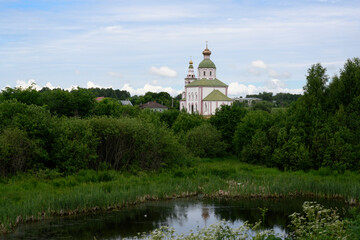 Fototapeta na wymiar View of Ilyinsky Church built in 1744 near the Kamenka River in summer in Suzdal, Russia
