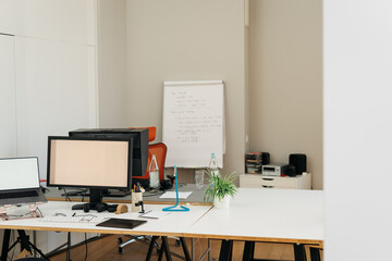Empty office with desks and computer