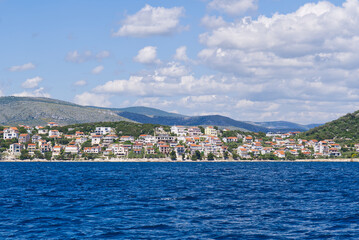 Naklejka na ściany i meble View of the mediterranean city from the sea. Rogoznica town on the Adriatic coast in Croatia. small fishing town on the croatian coast