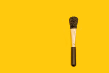 make up brushes isolated on yellow background