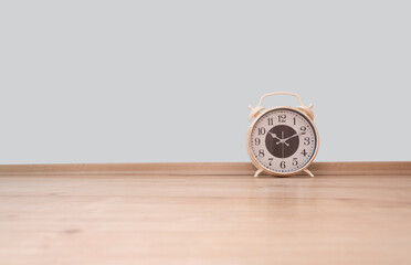 clock on hardwood floor, front view