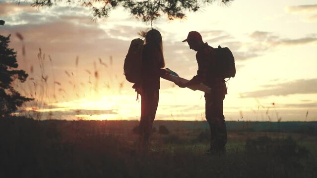 hiker group. team of hikers with backpacks silhouette with map the forest. nature travel a adventure concept. lifestyle hiker group with backpacks with map on the sunset. mountain outdoor view