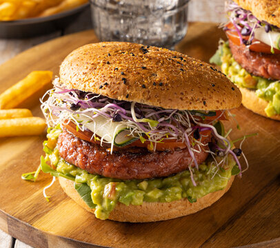 Vegan burger with guacamole and sprouts