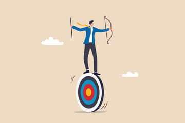 Purpose driven, motivation to reach goal and success, mission to achieve target or business strategy to drive success concept, ambitious businessman archery holding arrow and bow balance on target.