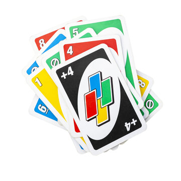 Deck of Uno Game Cards Scattered All Over on a Table. American