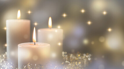 Obraz na płótnie Canvas three white burning candles on bright blurred background with copy space, glittering lights and sparks in festive atmosphere, greeting card for christmas, happy new year or other holidays